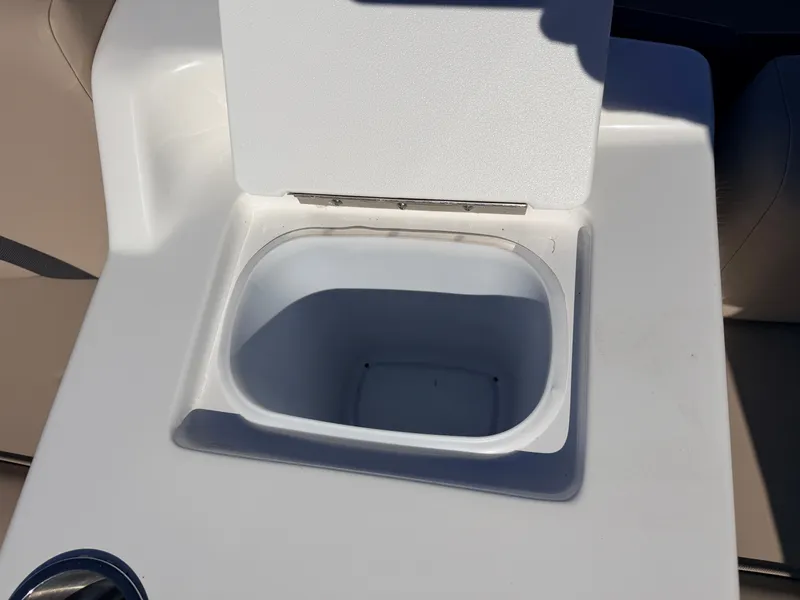 Slide: The Image of 2021 Hurricane Fun Deck 198 boat, open storage compartment. - 22
