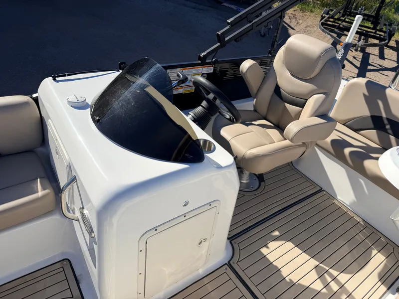 Slide: The Image of Interior view of a 2021 Hurricane Fun Deck 198 boat with steering wheel. - 24