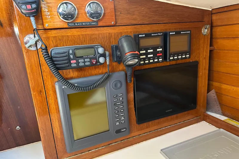 Slide: The Image of Navigation equipment on a 1966 CAL Cal 48 sailboat, featuring radios and displays. - 18