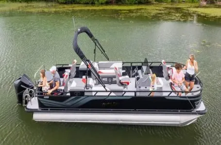 The Image of Avalon Venture 85 pontoon boat on lake with passengers, 2026 model. - 1