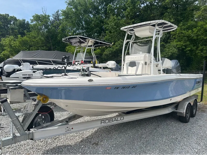 The Image of 2023 Robalo 226 Caymen boat on trailer outdoors. - 1