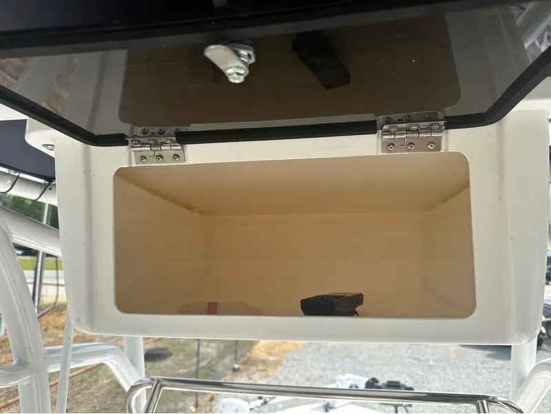 Slide: The Image of Open storage compartment on a 2023 Robalo 226 Caymen boat. - 13