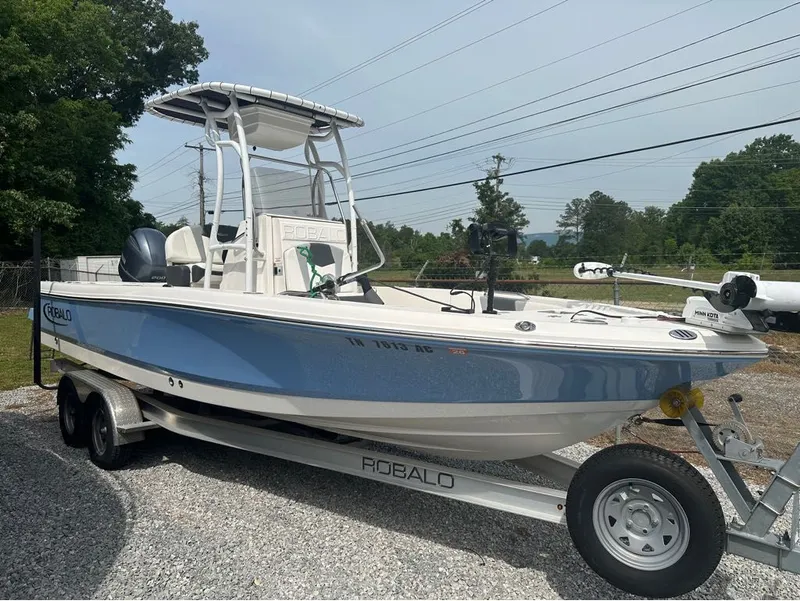 Slide: The Image of 2023 Robalo 226 Caymen boat on trailer outdoors. - 16