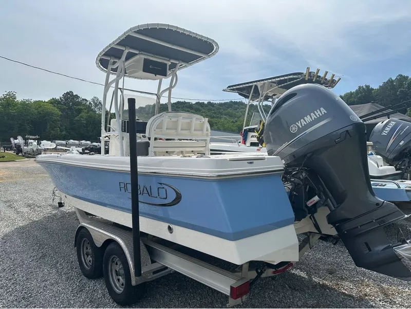 Slide: The Image of 2023 Robalo 226 Caymen boat with Yamaha engine on trailer. - 19