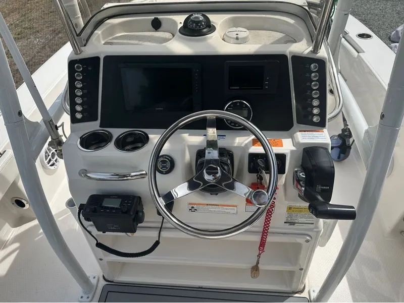 Slide: The Image of 2023 Robalo 226 Caymen helm with modern electronics and controls. - 4