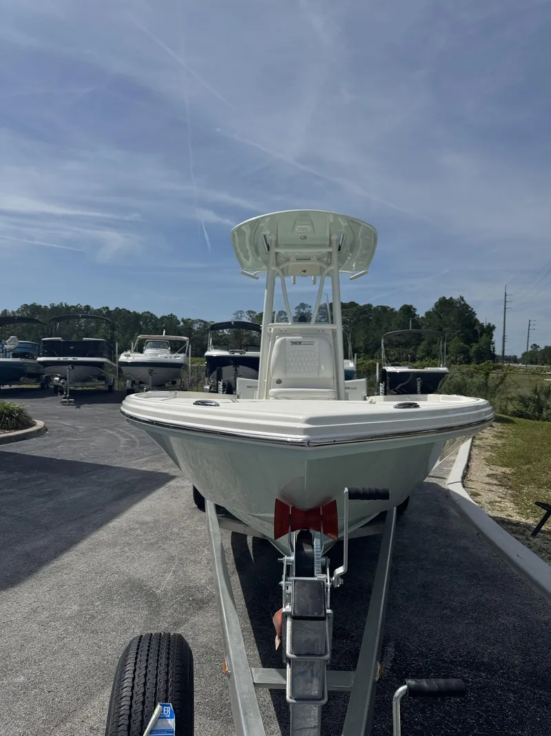 Slide: The Image of 2026 Pathfinder 2500 Hybrid boat on trailer in sunny weather. - 15