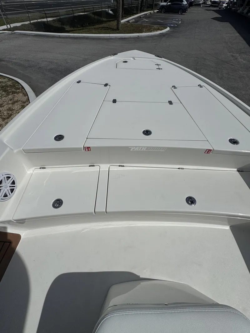 Slide: The Image of Pathfinder 2500 Hybrid 2026 boat deck with storage compartments. - 23