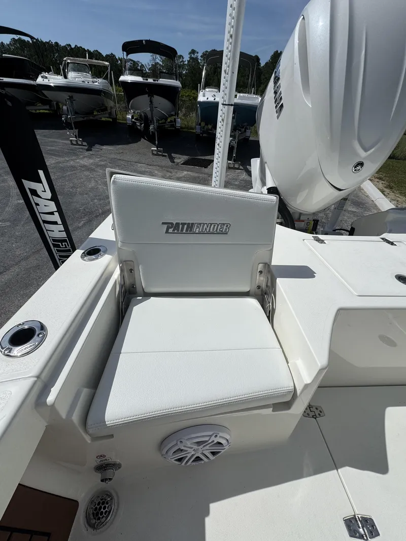 Slide: The Image of Pathfinder 2500 Hybrid 2026 boat seat with engine in background. - 28