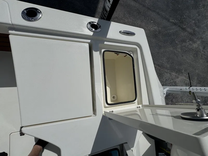 Slide: The Image of Pathfinder 2500 Hybrid 2026 boat deck with storage compartment open. - 30