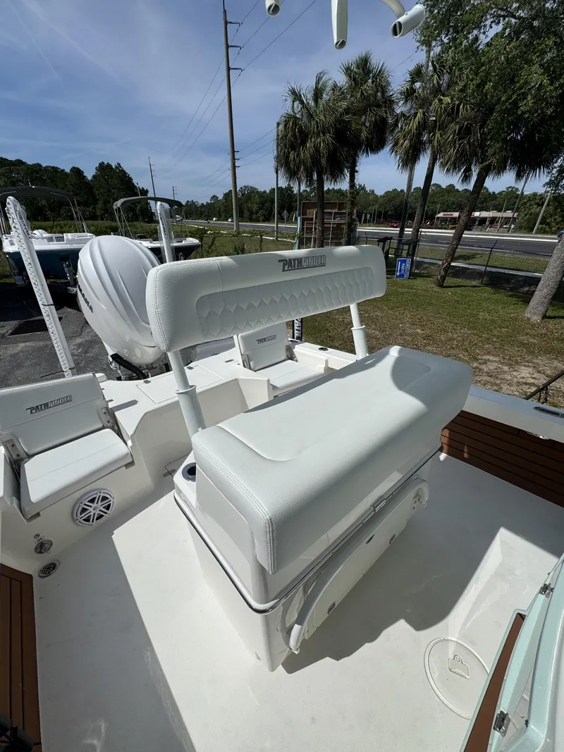 Slide: The Image of 2026 Pathfinder 2500 Hybrid boat with white seating area. - 35