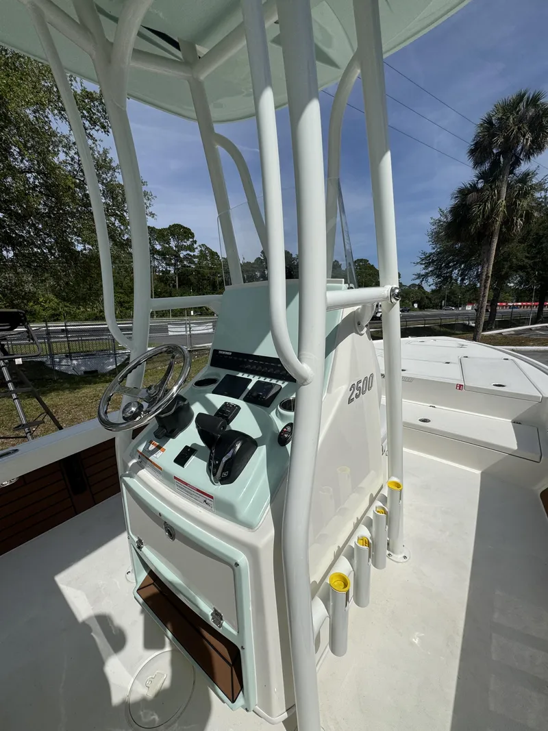 Slide: The Image of Pathfinder 2500 Hybrid 2026 helm with steering wheel and controls. - 37