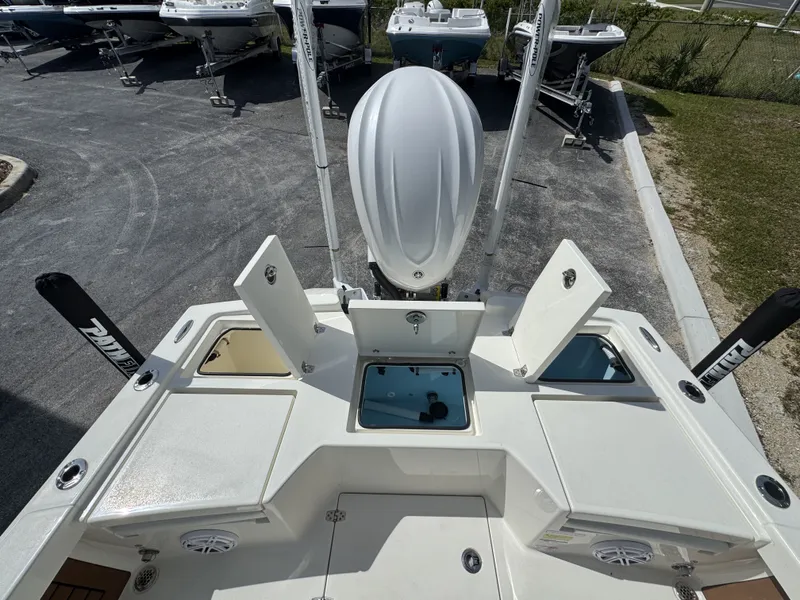 Slide: The Image of Pathfinder 2500 Hybrid 2026 with open storage compartments on a boat trailer. - 47