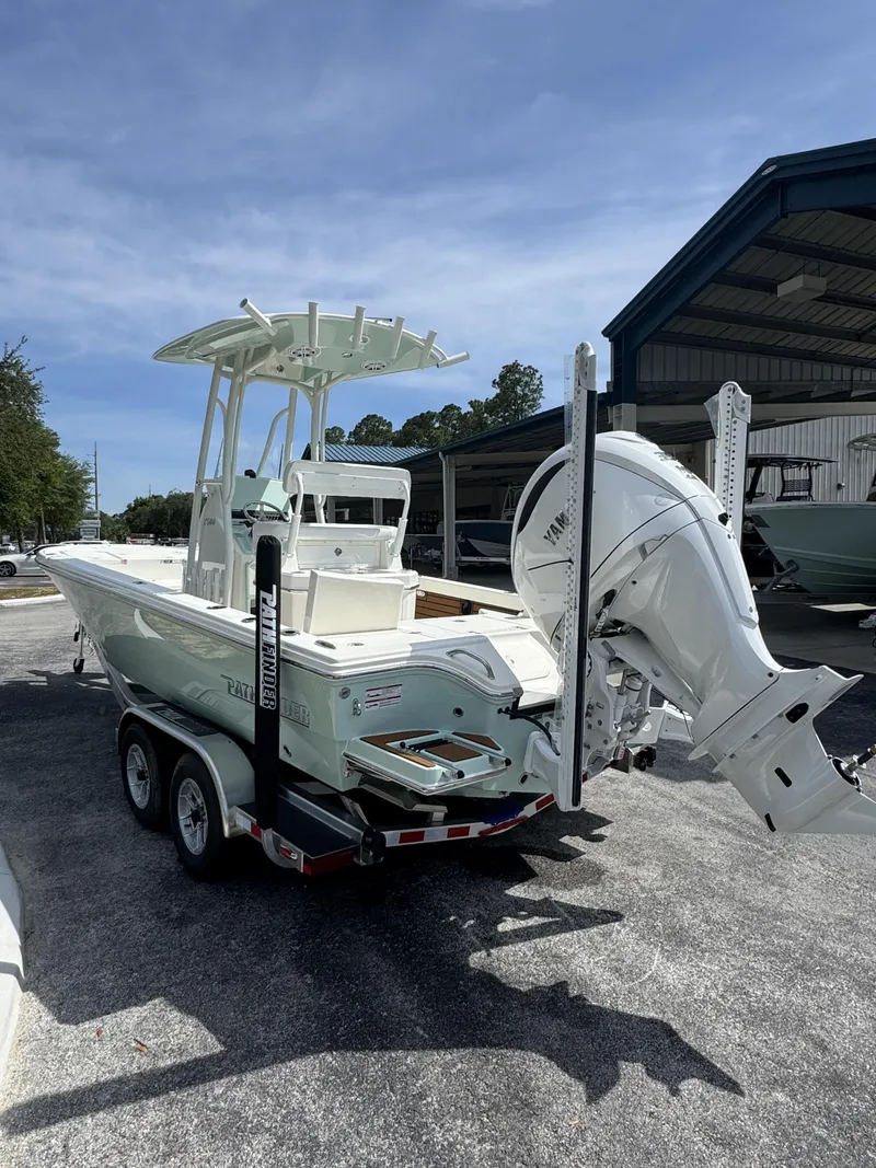 Slide: The Image of 2026 Pathfinder 2500 Hybrid boat on trailer outdoors. - 6