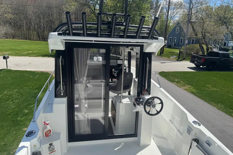 Slide: The Image of 2023 Jeanneau NC Sport 695 Series 2 boat with steering wheel and rod holders. - 21