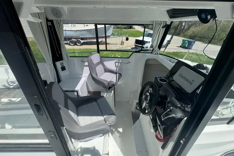 Slide: The Image of Interior of 2023 Jeanneau NC Sport 695 Series 2 boat with modern helm and seating. - 27