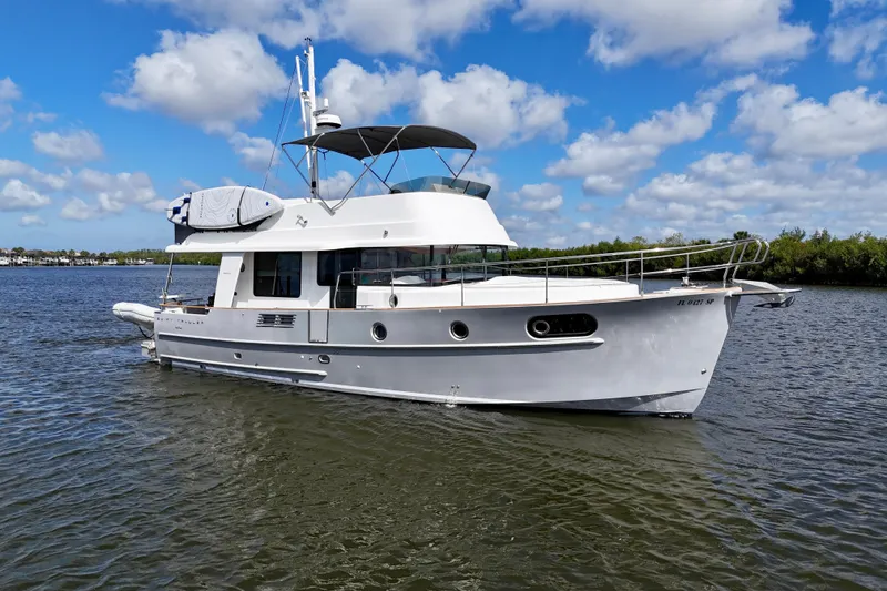 Slide: The Image of 2020 Beneteau Swift Trawler 44 cruising on a sunny day with blue skies. - 17