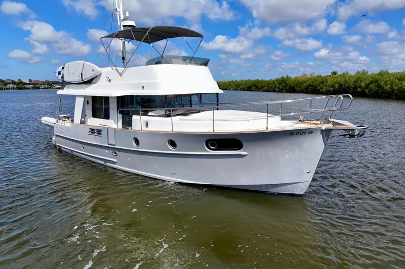 Slide: The Image of 2020 Beneteau Swift Trawler 44 cruising on a sunny day with blue skies. - 3