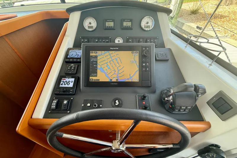 Slide: The Image of Beneteau Swift Trawler 44 helm with navigation system and controls, 2020 model. - 35