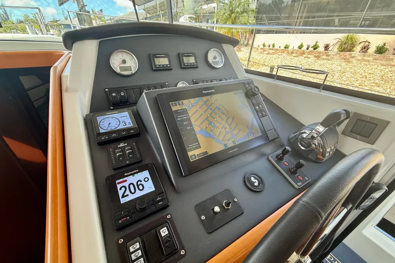 Slide: The Image of Helm station of 2020 Beneteau Swift Trawler 44 with navigation and control systems. - 36