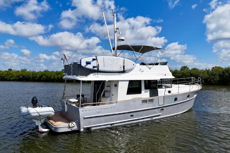 Slide: The Image of 2020 Beneteau Swift Trawler 44 cruising on a sunny day with blue skies. - 4