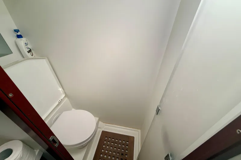Slide: The Image of Bathroom interior of 2020 Beneteau Swift Trawler 44, featuring toilet and shower area. - 57