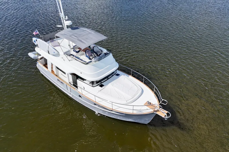 Slide: The Image of Aerial view of 2020 Beneteau Swift Trawler 44 cruising on calm waters. - 8