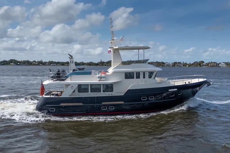 Slide: The Image of 2022 Alm Trawler Delfino 64 cruising on a sunny day, showcasing sleek design and luxury. - 10