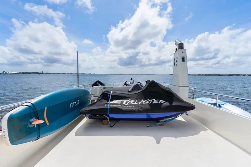 Slide: The Image of Deck of 2022 Alm Trawler Delfino 64 with jet ski and paddleboard. - 21