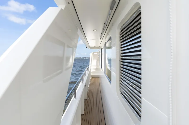 Slide: The Image of Side deck of 2022 Alm Trawler Delfino 64 yacht, featuring sleek design and ocean view. - 27