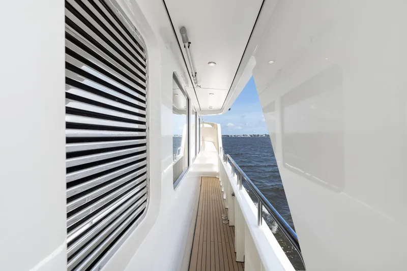 Slide: The Image of Side deck of 2022 Alm Trawler Delfino 64 yacht with ocean view. - 28