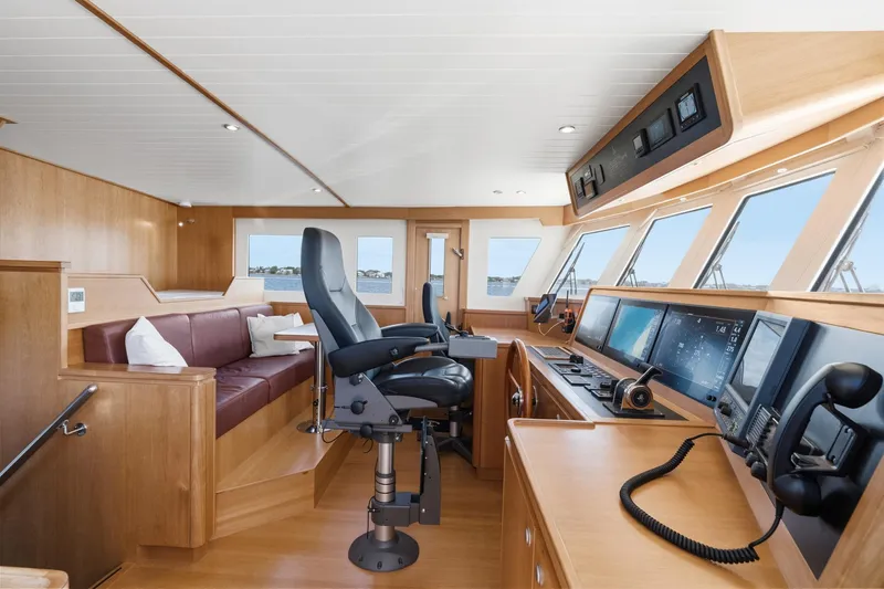 Slide: The Image of Luxurious helm of 2022 Alm Trawler Delfino 64 with modern navigation equipment. - 38