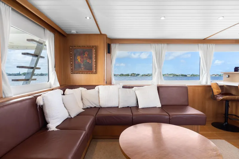 Slide: The Image of Luxurious interior of 2022 Alm Trawler Delfino 64 with leather seating and scenic windows. - 46
