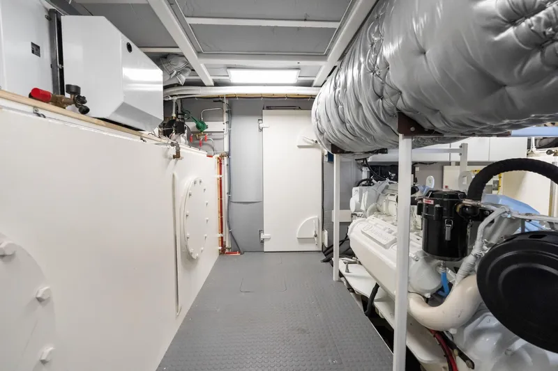 Slide: The Image of Engine room of 2022 Alm Trawler Delfino 64 by Jachtbouw De Alm, showcasing machinery and equipment. - 64
