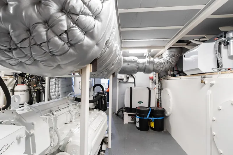 Slide: The Image of Engine room of 2022 Jachtbouw De Alm Alm Trawler Delfino 64, showcasing machinery and insulation. - 65