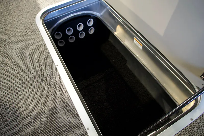 Slide: The Image of Barletta Aria 22F 2026 storage compartment with carpeted floor. - 11