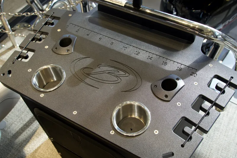 Slide: The Image of Barletta Aria 22F 2026 boat console with cup holders and ruler. - 12