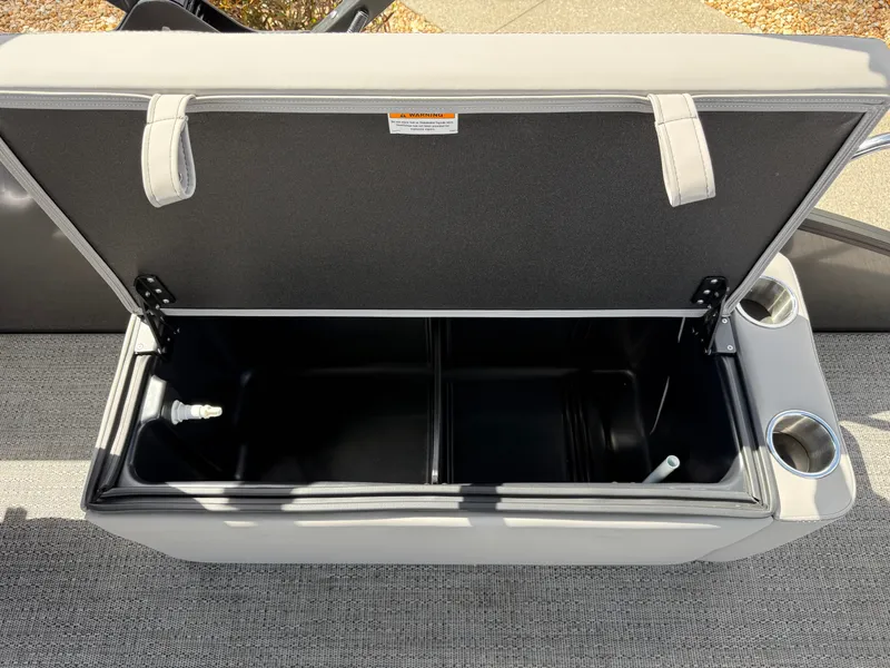 Slide: The Image of Barletta Aria 22F 2026 storage compartment with cup holders. - 13