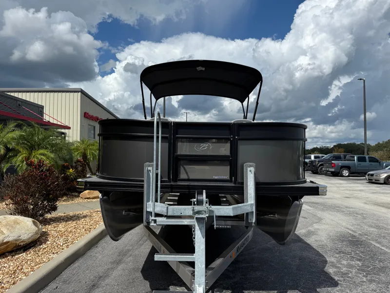 Slide: The Image of 2026 Barletta Aria 22F pontoon boat on trailer under cloudy sky. - 3