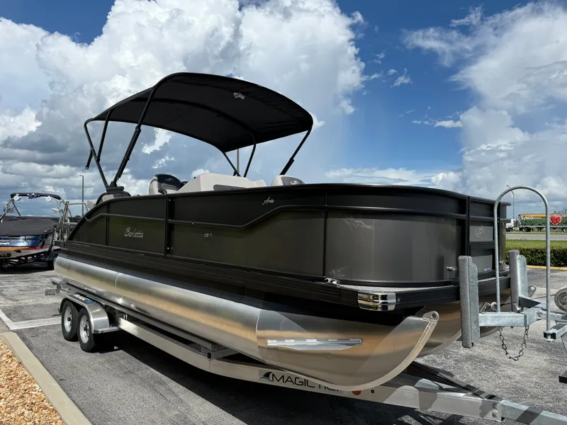 Slide: The Image of 2026 Barletta Aria 22F pontoon boat on trailer, cloudy sky. - 4