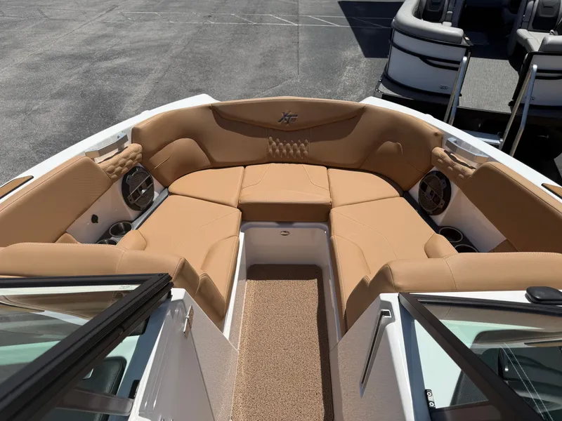 Slide: The Image of Interior of 2022 MasterCraft XT22 boat with beige upholstery. - 10