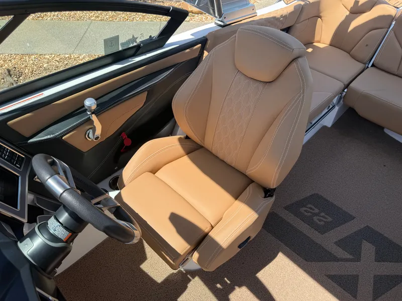 Slide: The Image of Interior of a 2022 MasterCraft XT22 boat with beige leather seat. - 13