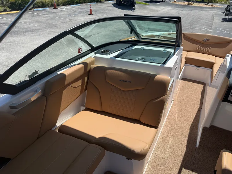 Slide: The Image of Interior of a 2022 MasterCraft XT22 boat with beige seating. - 14