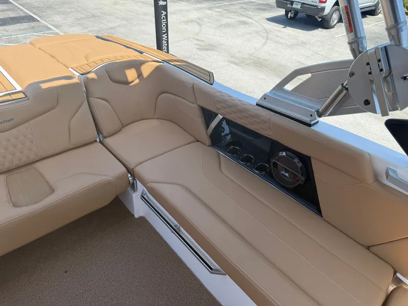 Slide: The Image of Interior of a 2022 MasterCraft XT22 boat with beige leather seating. - 16