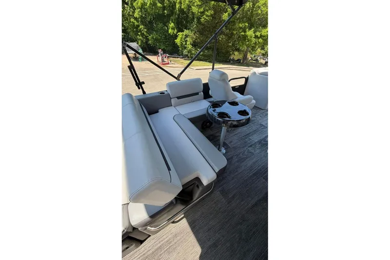 Slide: The Image of 2023 Godfrey Sweetwater 2486 SFL boat interior with seating and cup holders. - 13