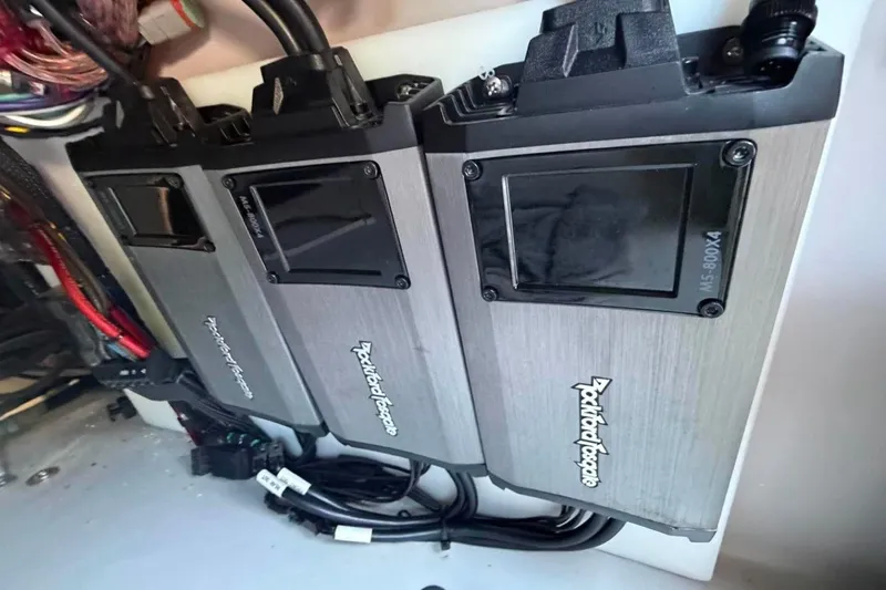 Slide: The Image of Rockford Fosgate amplifiers installed in a 2023 Godfrey Sweetwater 2486 SFL boat. - 21