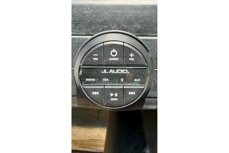 Slide: The Image of JL Audio control panel on 2023 Godfrey Sweetwater 2486 SFL boat dashboard. - 23