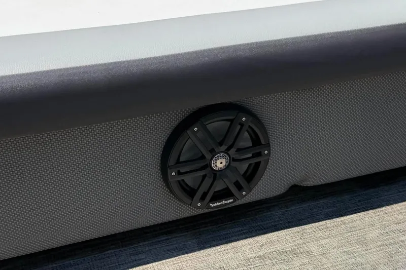 Slide: The Image of 2023 Godfrey Sweetwater 2486 SFL boat speaker detail, featuring sleek design and textured upholstery. - 25