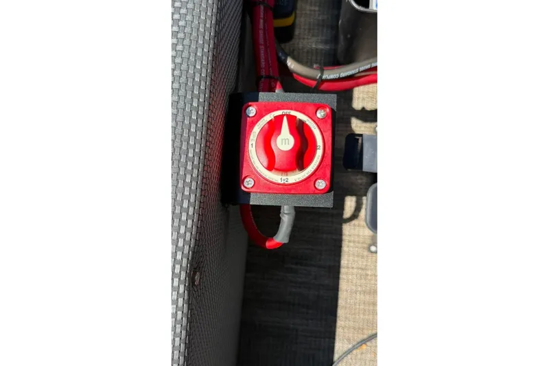 Slide: The Image of Red battery switch on 2023 Godfrey Sweetwater 2486 SFL boat, showing multiple settings. - 29