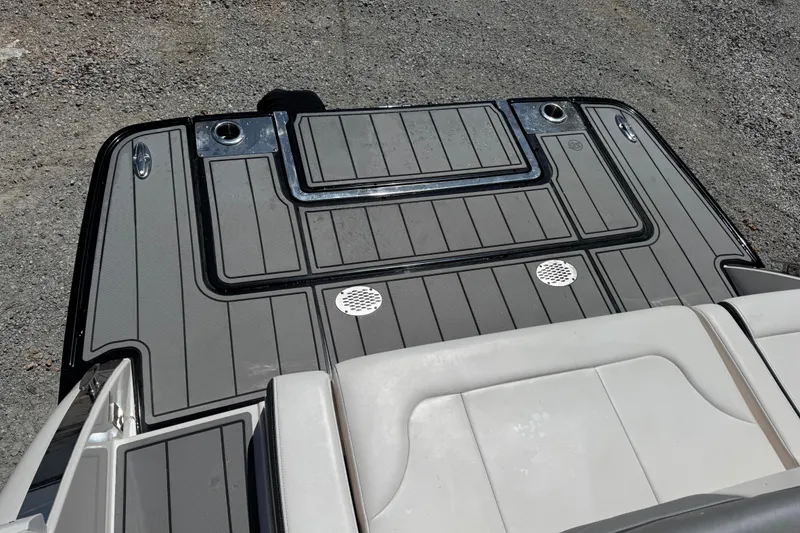 Slide: The Image of 2021 Chaparral 287 SSX boat deck with sleek gray and black design. - 10