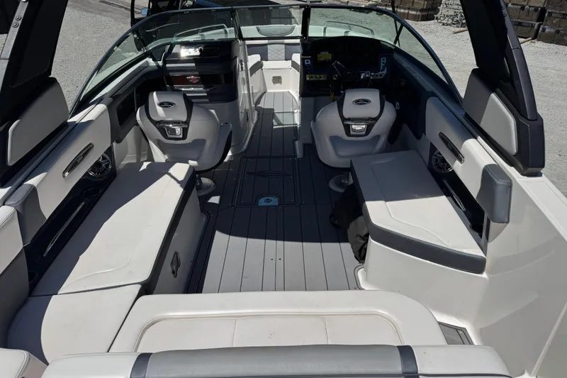Slide: The Image of 2021 Chaparral 287 SSX boat interior with spacious seating and modern design. - 11